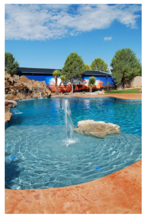 example of recent work, commercial pool with fountain in raised area.