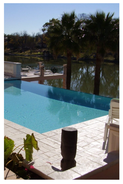 example of recent work, infinity pool overlooking a lake.