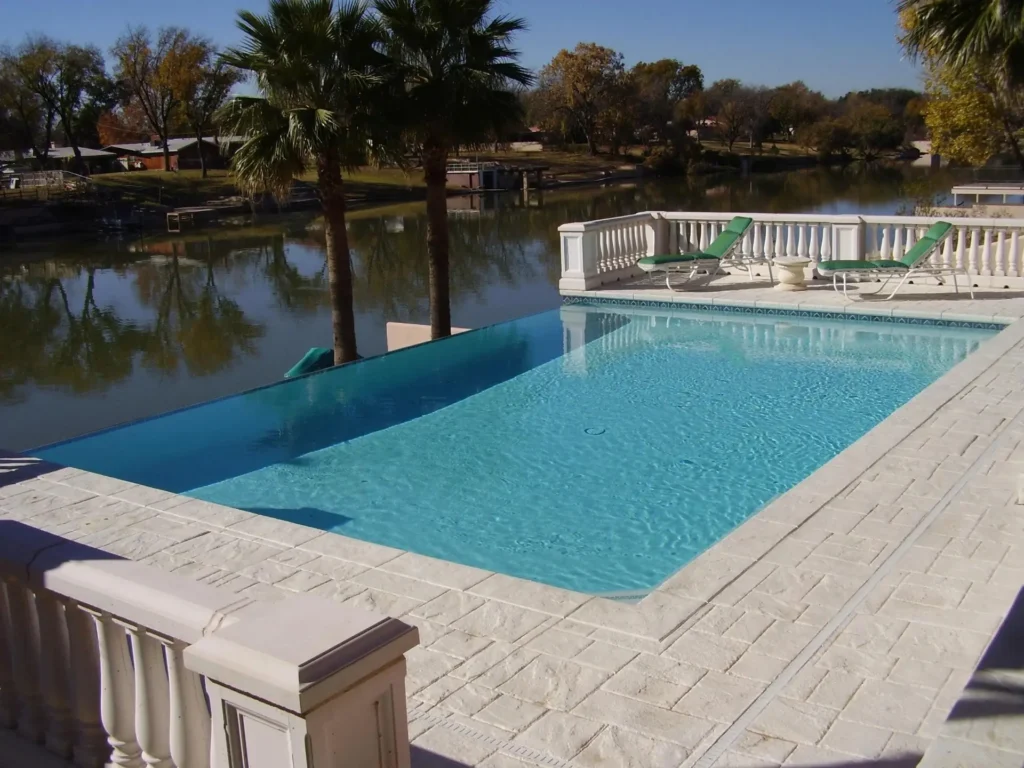Custom inground pool overlooking a lake, built by swimming pool contractors in NM