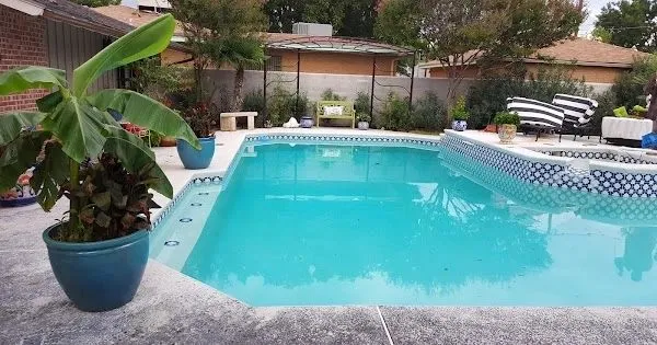 Remodeled pool with new tile band and fresh plaster